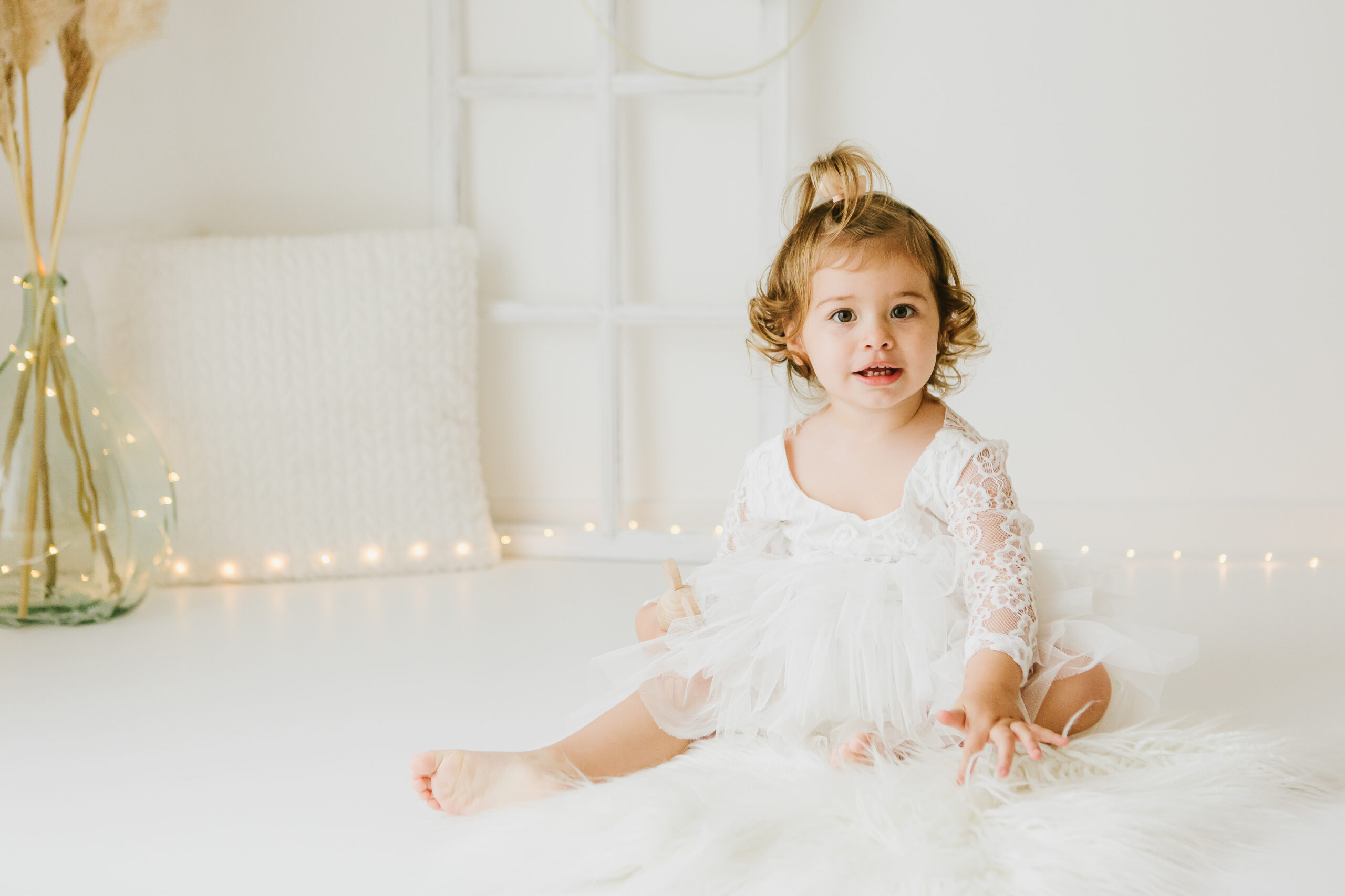 Bébé souriant pendant une séance photo pour ses 1 an 