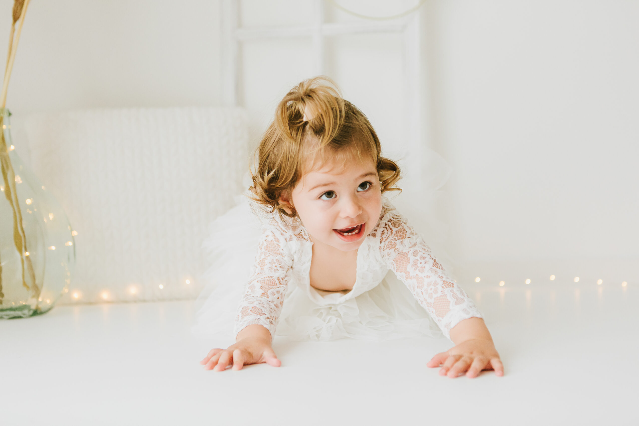 Bébé souriant pendant une séance photo pour ses 1 an 